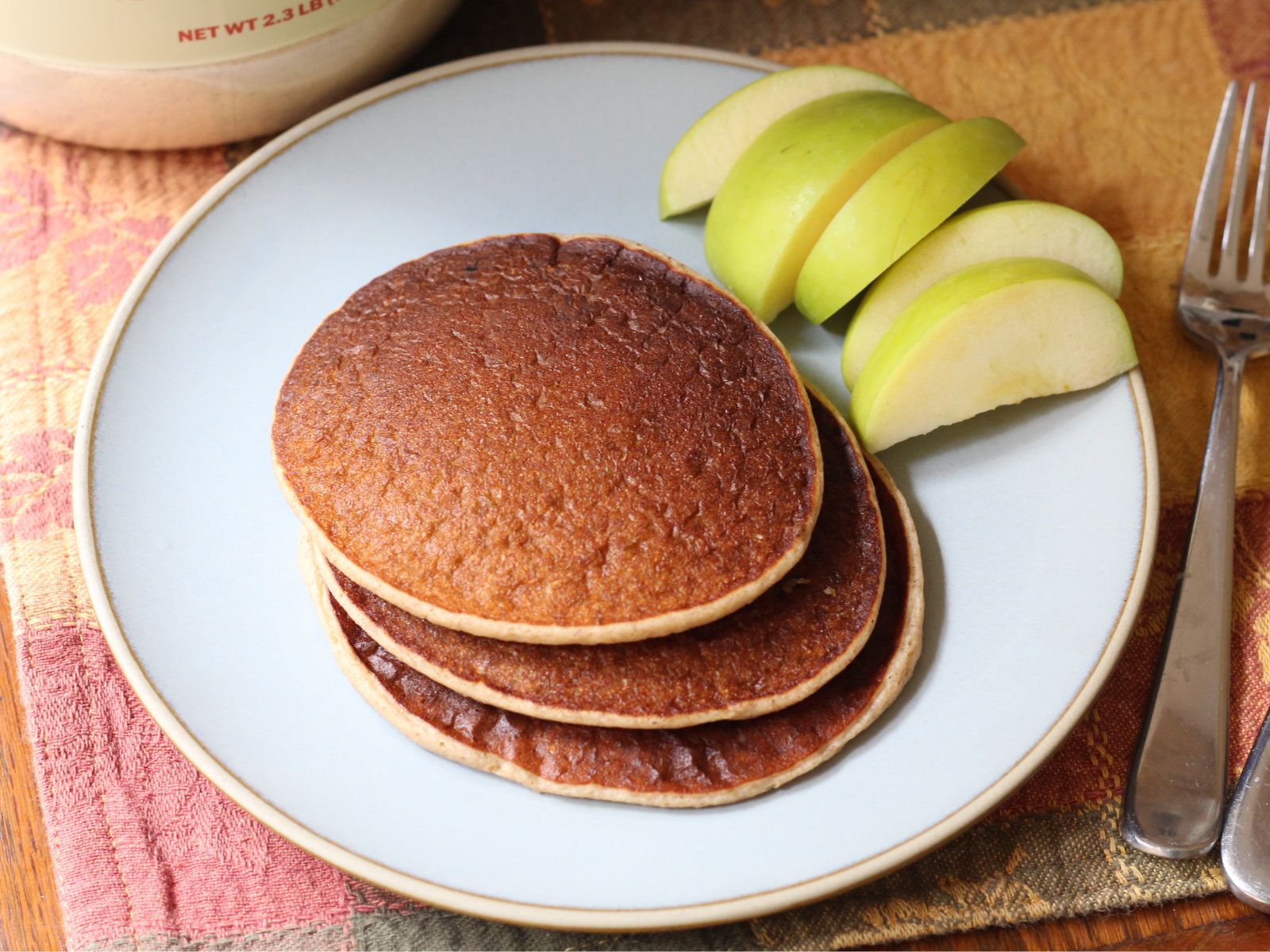 apple pie protein pancakes and apples on a plate